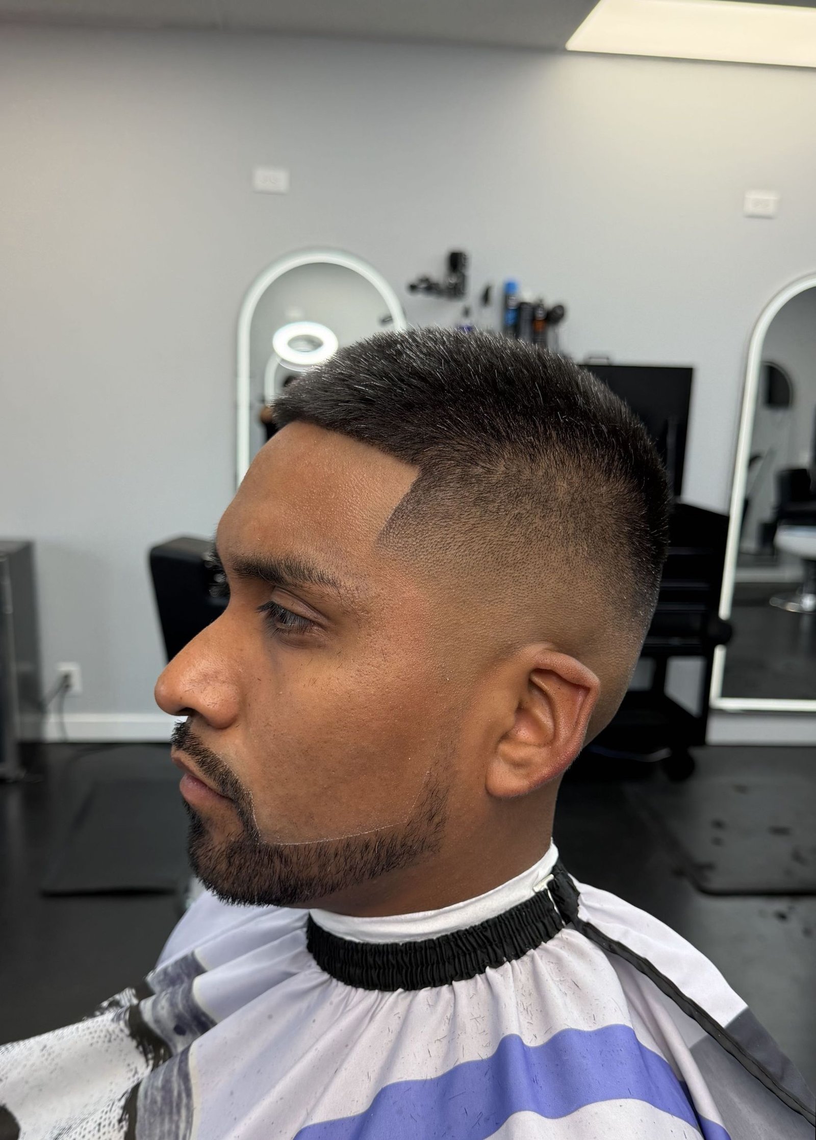 Skin fade with beard line-up