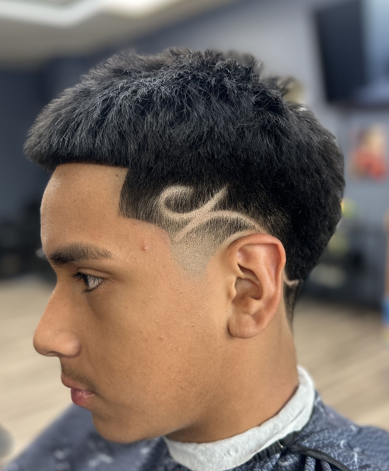 Textured top with freestyle hair design
